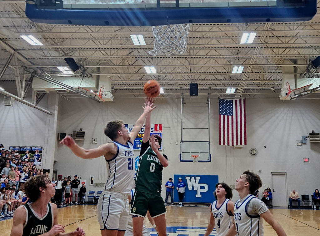 Faith Christian’s Conner Richerzhagen shoots a floater as White Plains’ Daniel Williams defends Friday at White Plains.