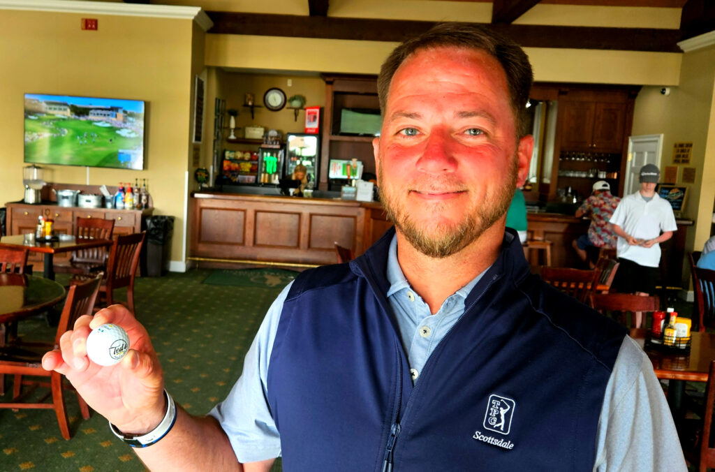 Jeremy McGatha holds the ball he holed for an ace on No. 17 during Sunday’s final round of the Calhoun County Team Championship at Silver Lakes. (Photo by Joe Medley)